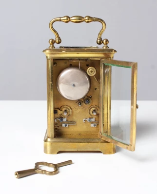 Back of a travelling clock with striking mechanism