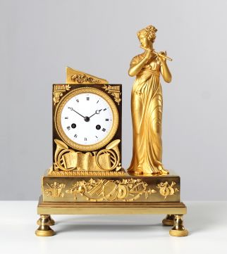 French Empire Clock Gold Plated with Depiction of a Lady Playing the Flute