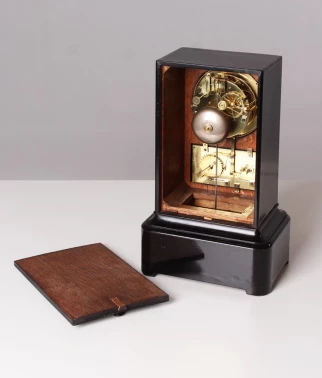 Antique clock with calendar, black wood, France circa 1850