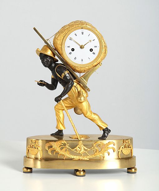 Pendule Au Negre, Portefaix, Jean-Andre Reiche, Empire, circa 1810 - Paris
Bronze, enamel
Empire around 1810